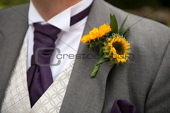 groom with sunflower buttonhole