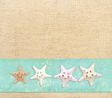 Starfishes on canvas texture