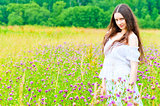 beautiful girl standing in a field