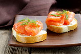 Sandwich with red fish (salmon) and dill
