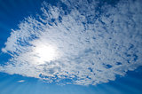 blue sky with clouds and sun rays