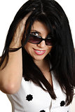 Beautiful woman smiling looking over sunglasses