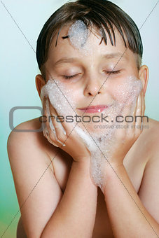 Young boy child washing cleansing face soap and water