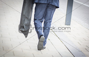 Suited man walking