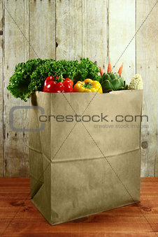 Bag of Grocery Produce Items on a Wooden Plank