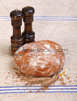 Traditional bread with salt and pepper shaker