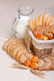 Assorted sliced bakery products and milk