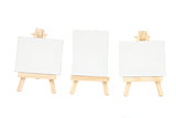 set of easels with blank canvas