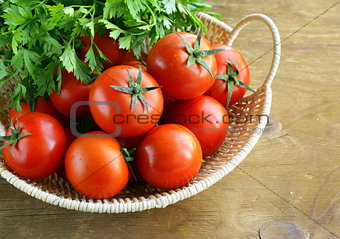 fresh ripe tomatoes in a basket on the table
