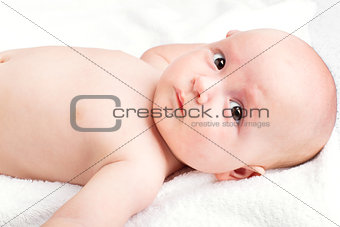 Cute baby lying on towel