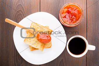 Breakfast with tea, toast and apricot jam