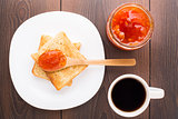 Breakfast with tea, toast and apricot jam