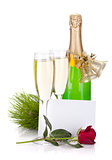 Champagne, empty card and rose flower