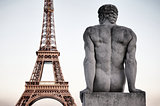 Paris France Eiffel Tower with Statue of Man Dusk Sky