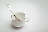 White cup and spoon