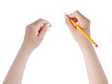 female teen hands with pencil and eraser
