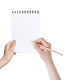 female teen hands writing something in notepad