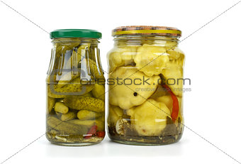 Glass jars with cornichons and cymblings