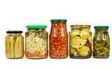 Five glass jars with marinated vegetables