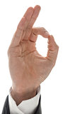 Hand of a businessman showing an Ok sign