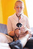 Nurse with stethoscope - blood pressure