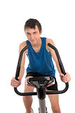 Teenage boy using an exercise bike fitness