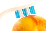 Toothbrush on fruit