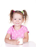 Cute little girl drinks milk
