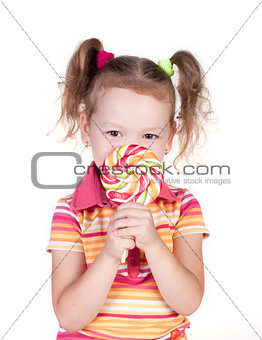 Cute little girl holding big lolly pop