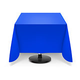 Square table with blue tablecloth.