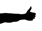 close up detail one man hand silhouette thumb up gesture