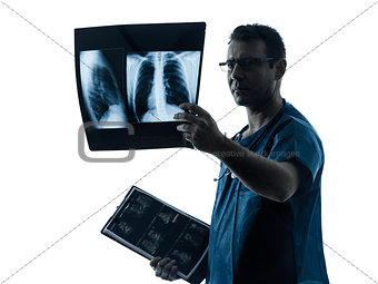 doctor surgeon radiologist examining lung torso  x-ray image