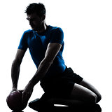 man exercising workout holding fitness ball posture