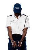 Ashamed policeman with handcuffs