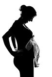pregnant woman holding baby clothes
