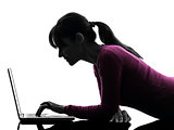woman serious computing laptop computer silhouette