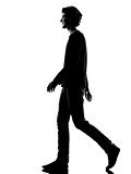 young man silhouette smiling walking