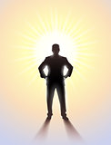 Silhouette of man standing in sunlight.