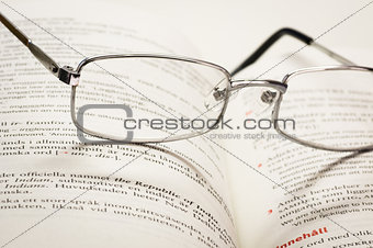 Reading glasses and dictionary
