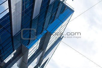 blue mirrored windows of modern office building