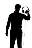 Male in silhouette showing headphones