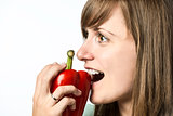 Woman biting in pepper