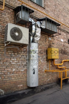 air conditioner on the brick wall with airshaft 