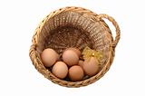 few eggs in a basket with decorated one