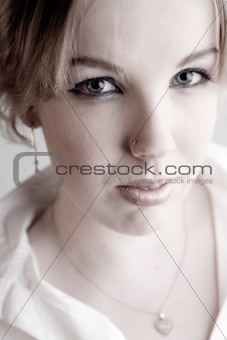 Portrait of a hypnotizing blond curly woman