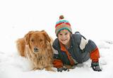 Boy Playing with Dog in Snow