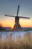 Dutch windmill in winter scene