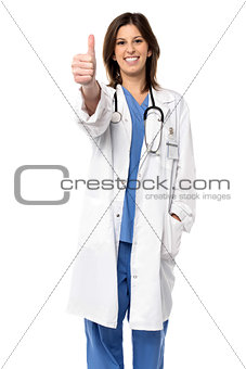 Smiling doctor giving a thumbs up gesture