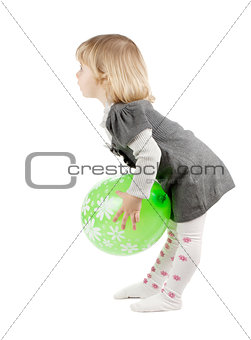 Baby girl with a green balloon