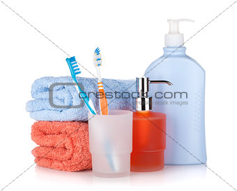 Toothbrushes, shampoo bottles and two towels